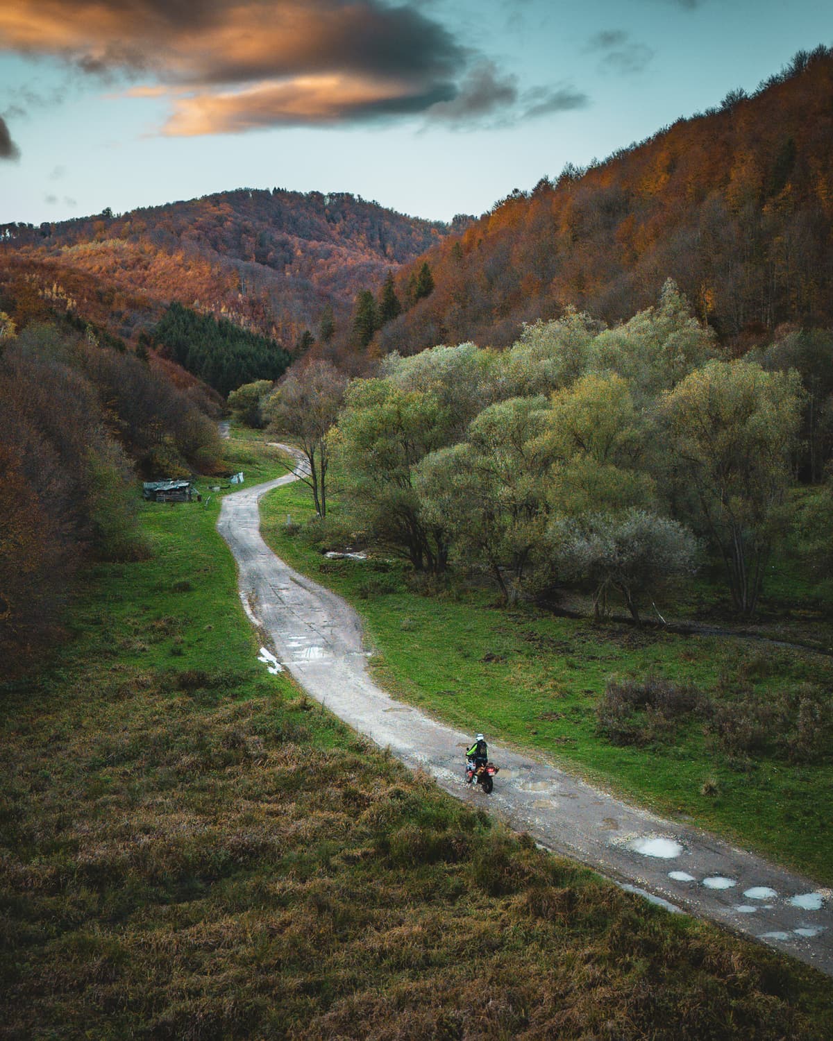 Aerial view of a rider on a valley road